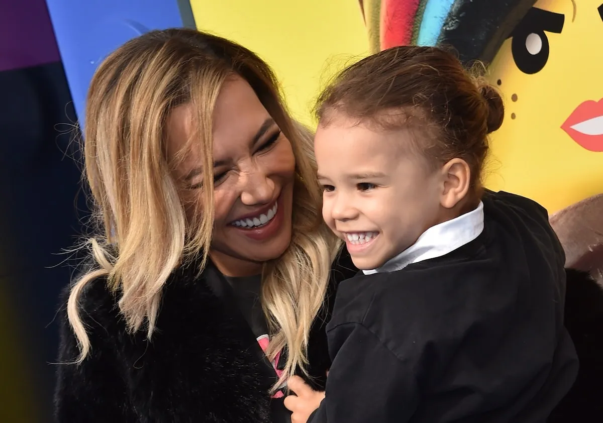 Actor Naya Rivera smiles at her son, Josey, as they pose on the red carpet at a movie premiere in 2019