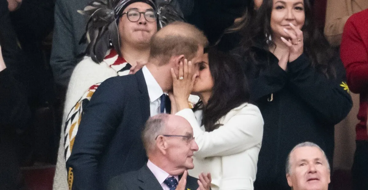 Prince Harry and Meghan Markle kiss during the opening ceremony of the 2025 Invictus Games in Vancouver, British Columbia, Canada