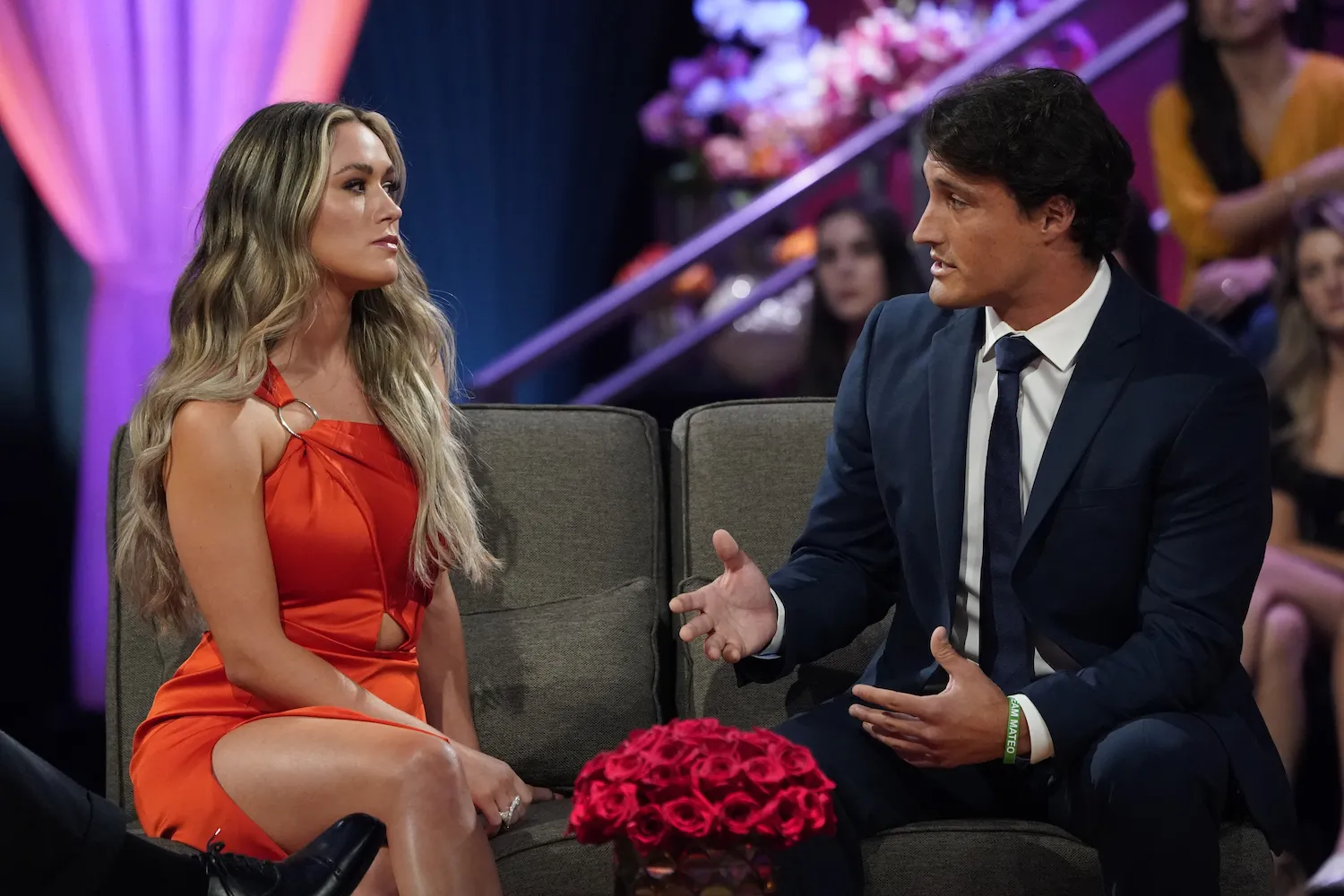 Rachel Recchia and Tino Franco during 'The Bachelorette' After the Final Rose special. Rachel is wearing a red dress and looking sternly at Tino, who is gesturing with his hands.