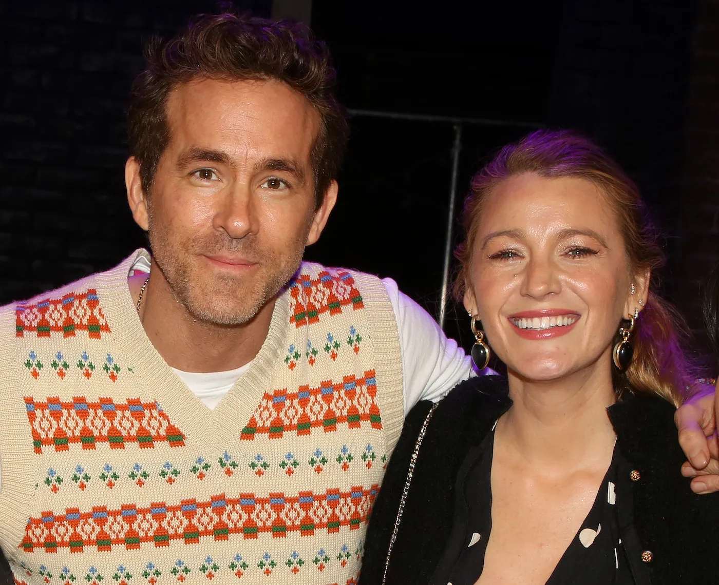 A close-up of Ryan Reynolds and Blake Lively smiling while backstage on Broadway