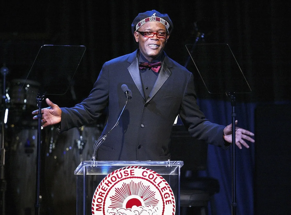 Wearing a Morehouse hat, Samuel L. Jackson speaks onstage at a benefit for Morehouse College in 2004