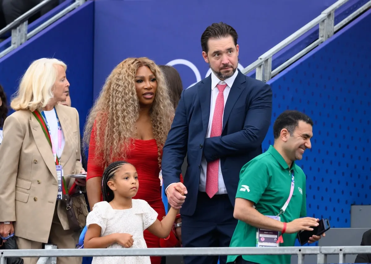 Alexis Ohanian holds his daughter Adira's hand while standing next to wife Serena Williams at the 2024 Olympics