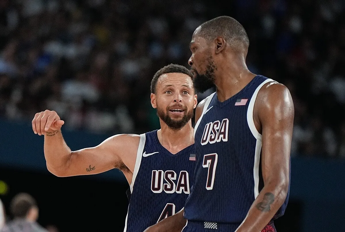 Stephen Curry and Kevin Durant react after the men's basketball gold medal game between the United States and France at the Paris 2024 Olympics