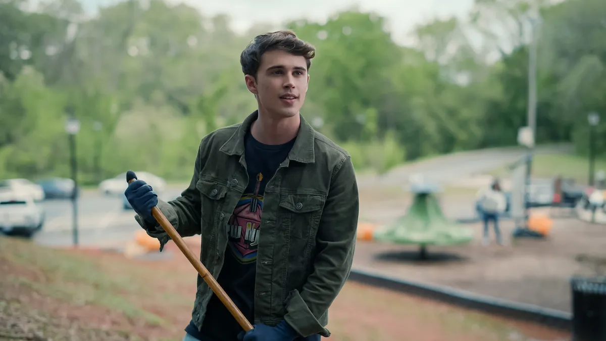 Kyle (Logan Allen) holding a shovel in 'Sweet Magnolias' Season 4