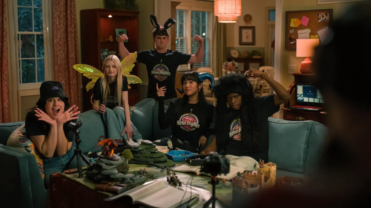 Group of teenagers wearing costumes and sitting on a couch in 'Sweet Magnolias' Season 4