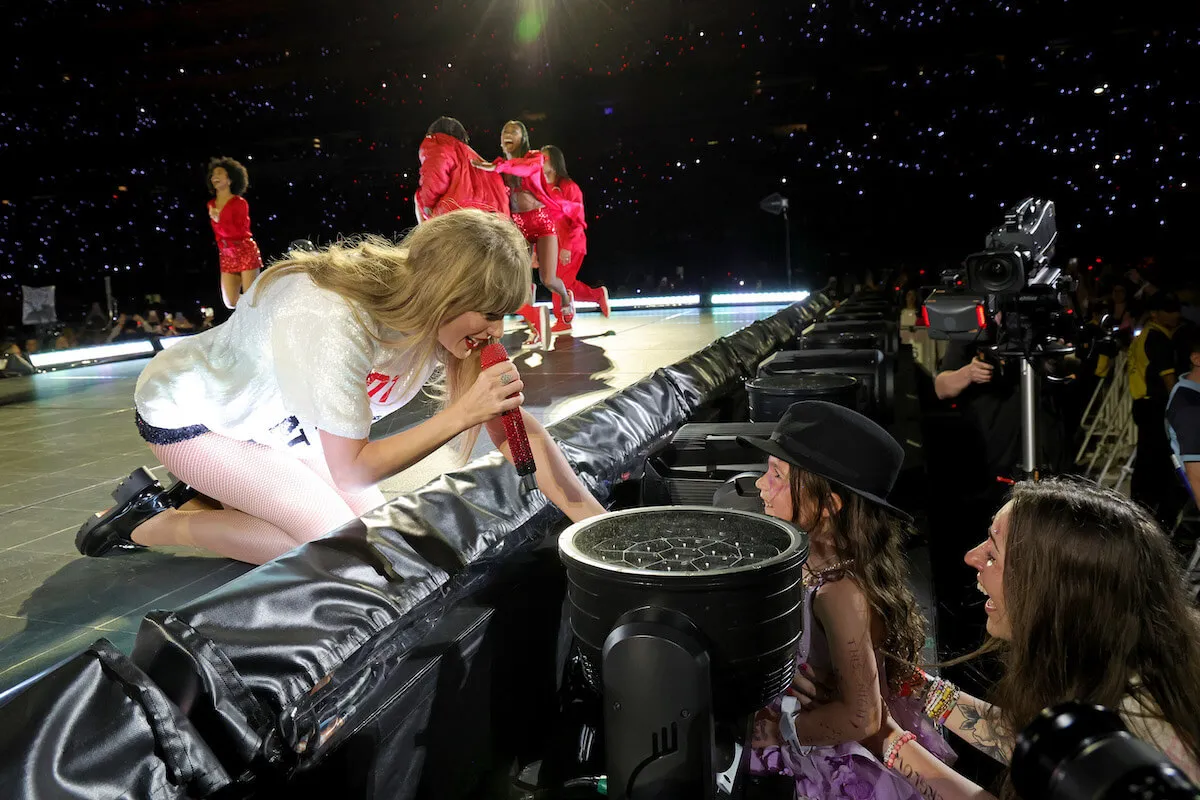 Taylor Swift has a fan interaction as she gives away her '22' hat during the Eras Tour