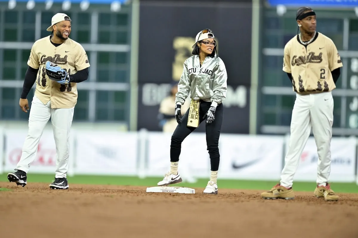 Participants Robinson Canó, Teyana Taylor, and Travis Scott guard the bases at the 2025 Cactus Jack Foundation HBCU Celebrity Softball Classic