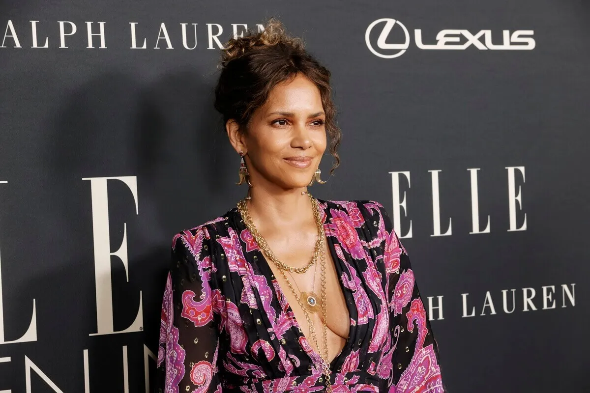 Halle Berry attends ELLE's 27th Annual Women In Hollywood Celebration while wearing a pink outfit.