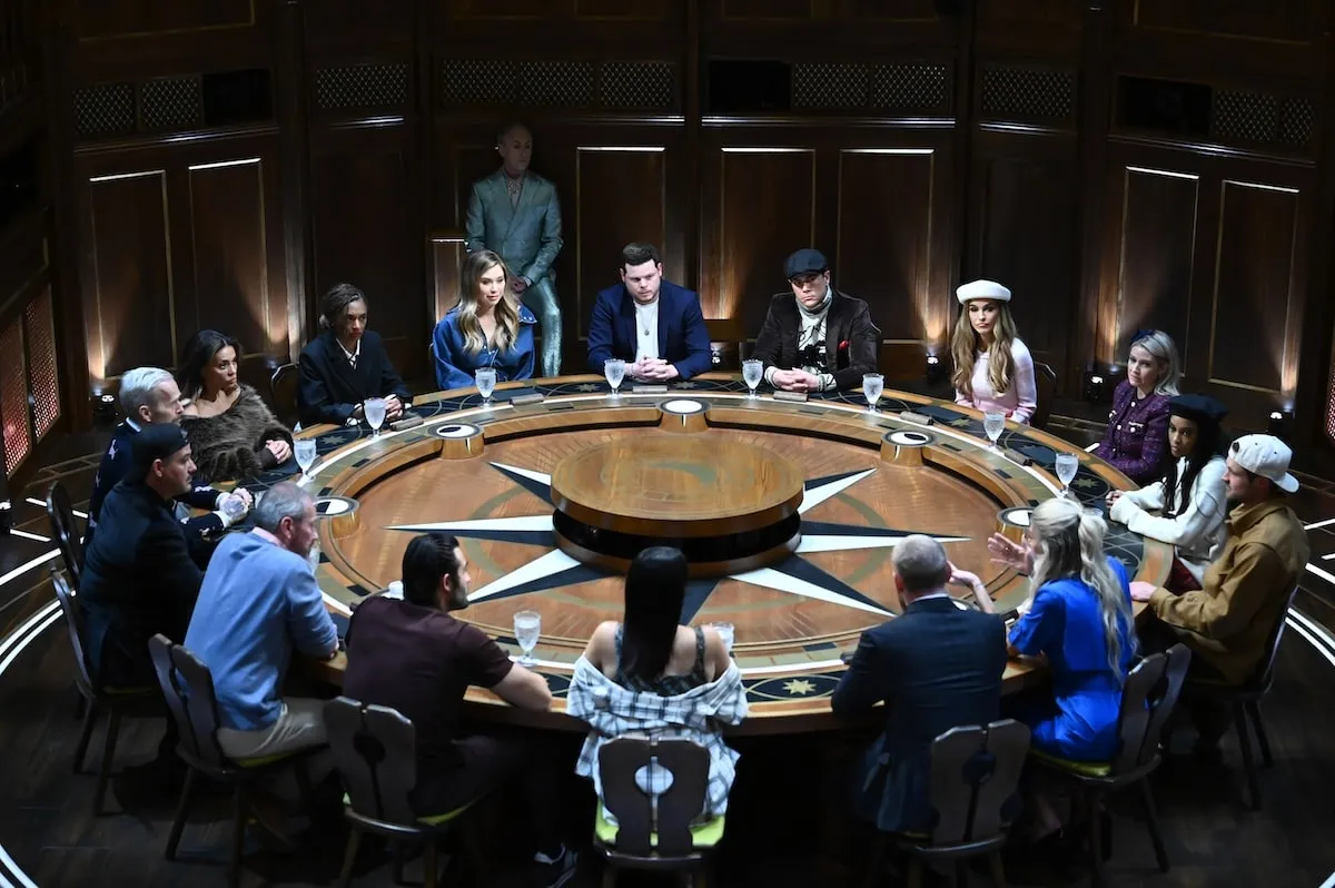 The cast of The Traitors sits at the round table before eliminating someone