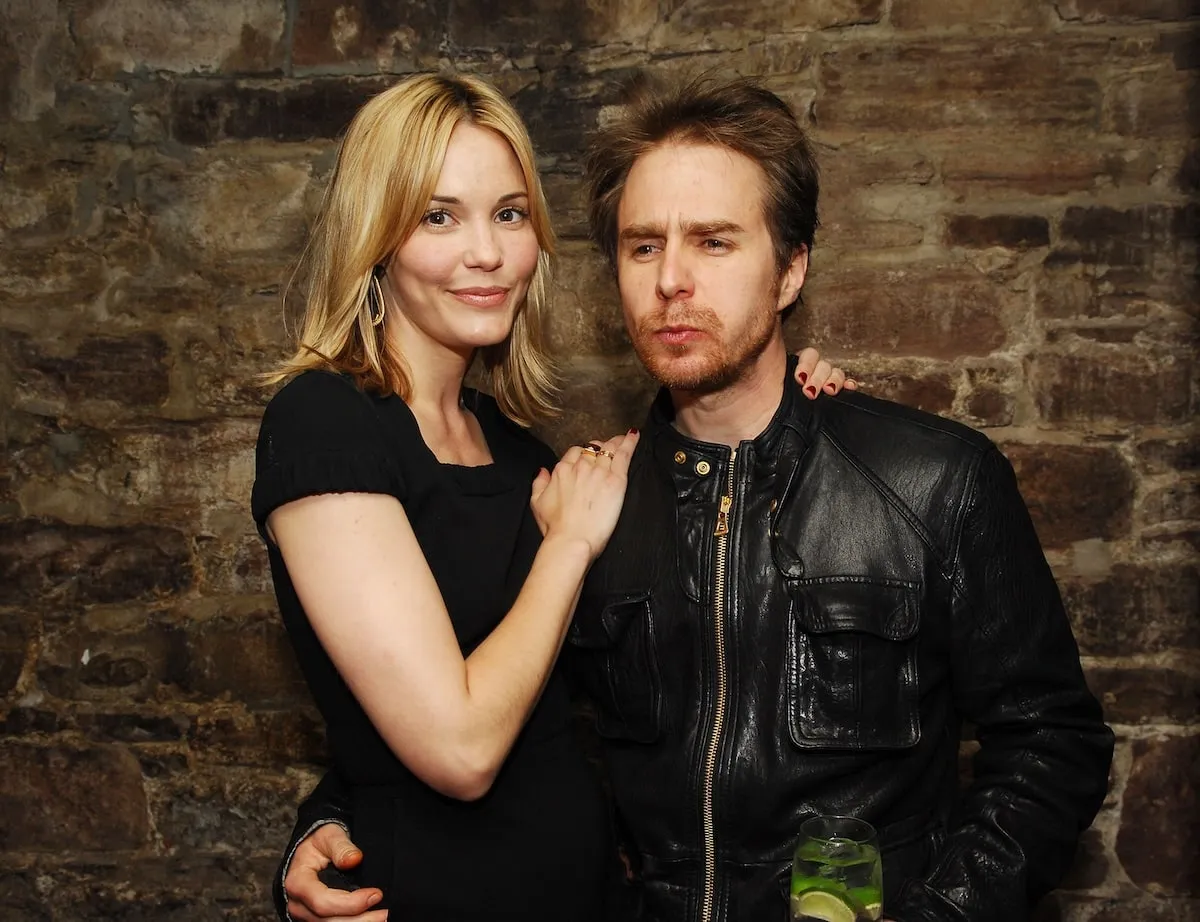 Wearing all black, Leslie Bibb and Sam Rockwell hug each other at the 2009 Tribeca Film Festival