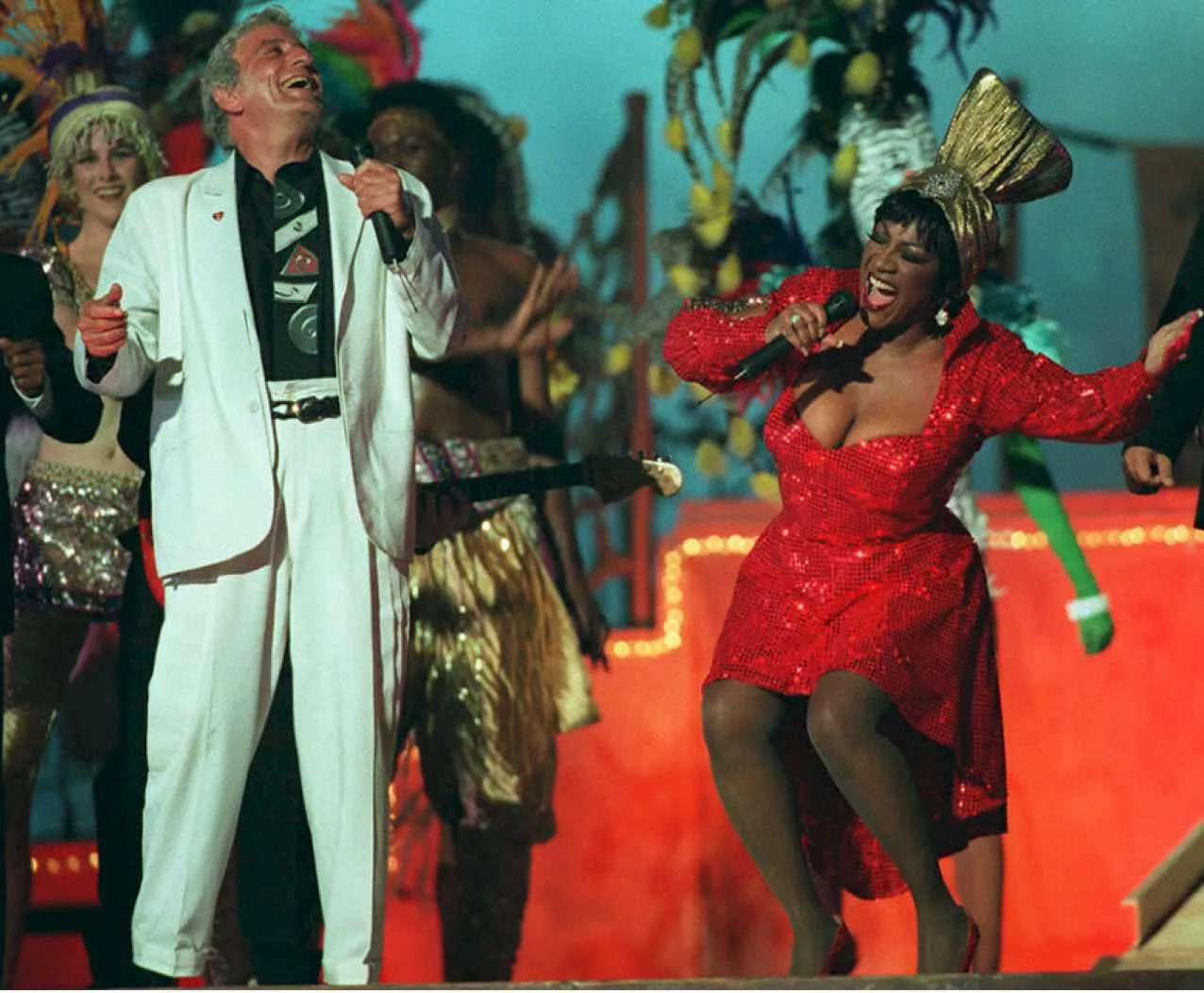 Tony Bennett, in a white suit, and Patti Labelle, in a red dress and hat, at the Super Bowl Halftime show