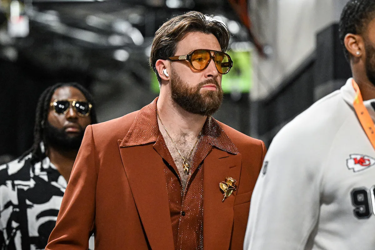 Travis Kelce arrives at Super Bowl LIX wearing a brown suit.