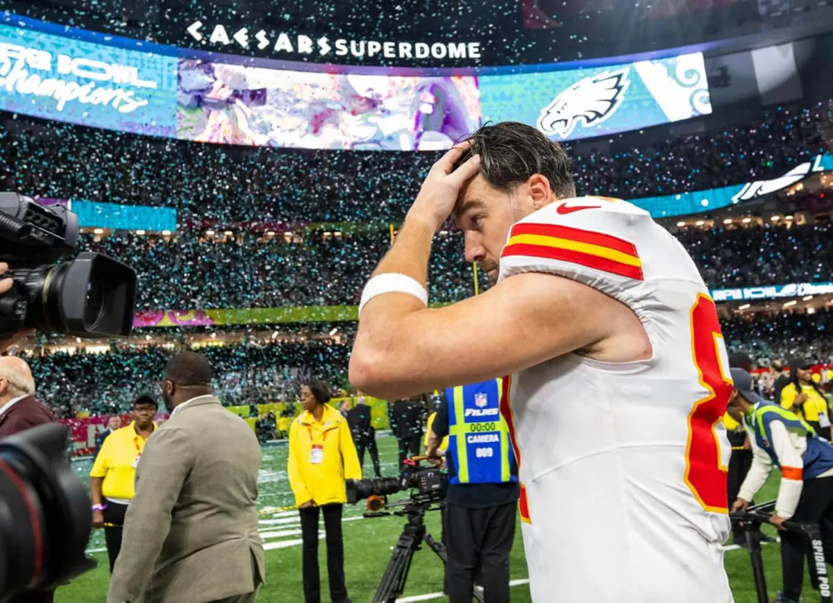 Travis Kelce runs his hand through his hair during the Super Bowl in 2025.