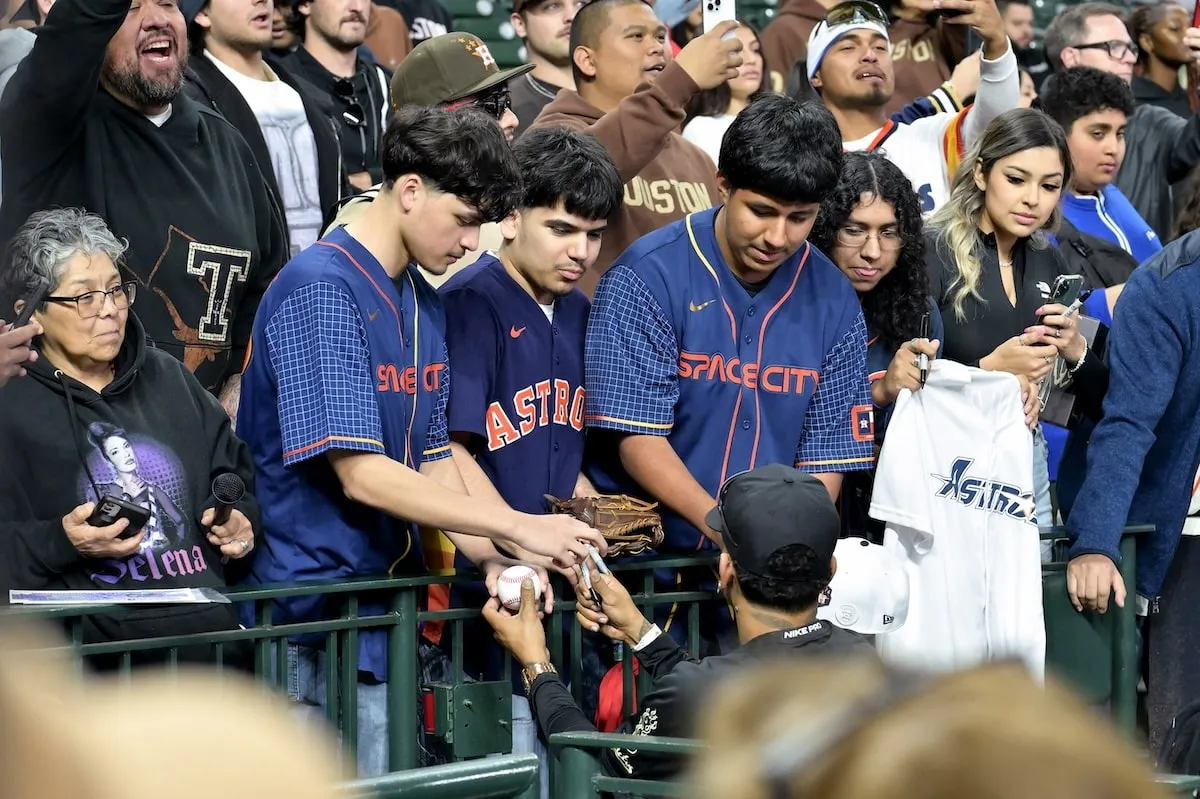 Rapper Ozuna signs autographs during the 2025 Cactus Jack Foundation HBCU Celebrity Softball Classic