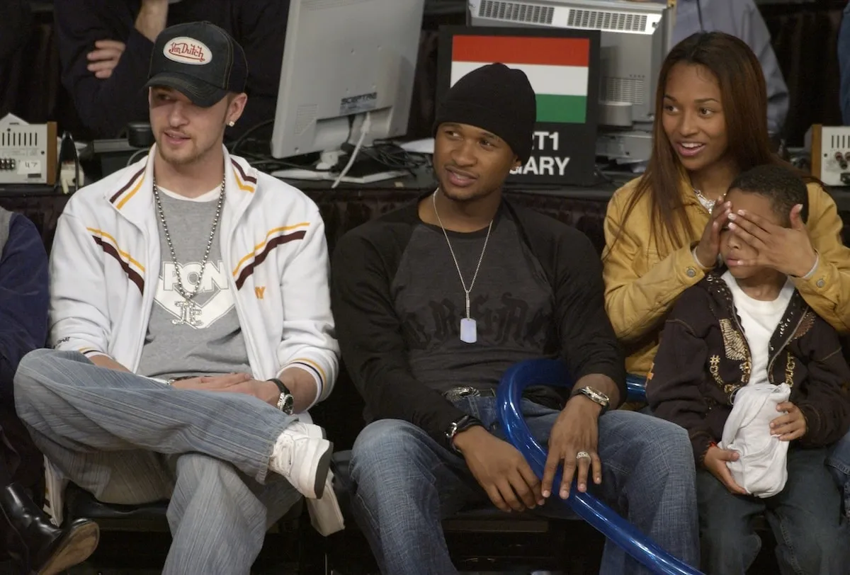 Justin Timberlake, Usher, and Chilli with her son Tron sit front row at the 2003 NBA All-Star Game in Atlanta