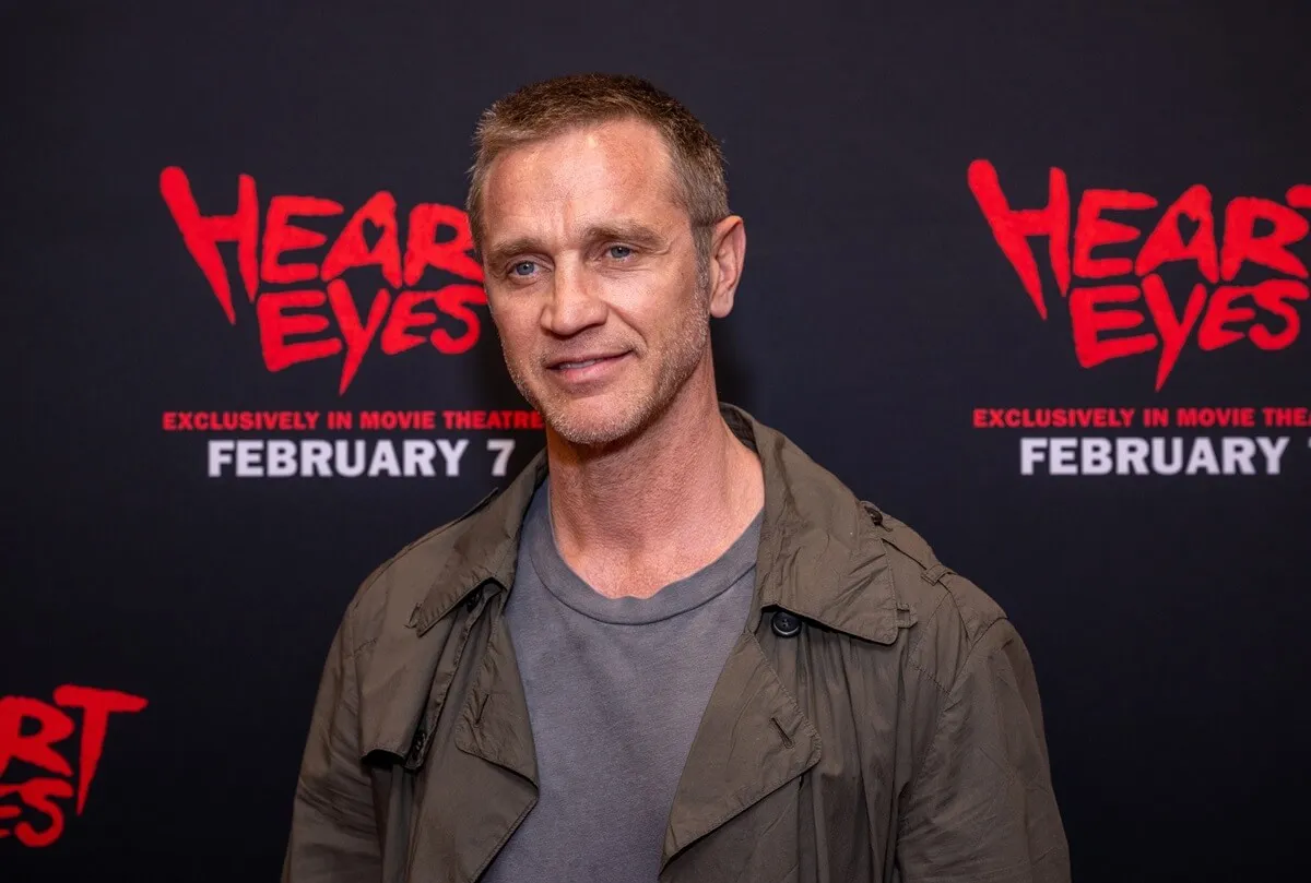 Devon Sawa posing in a jacket and shirt at the premiere of 'Heart Eyes'.