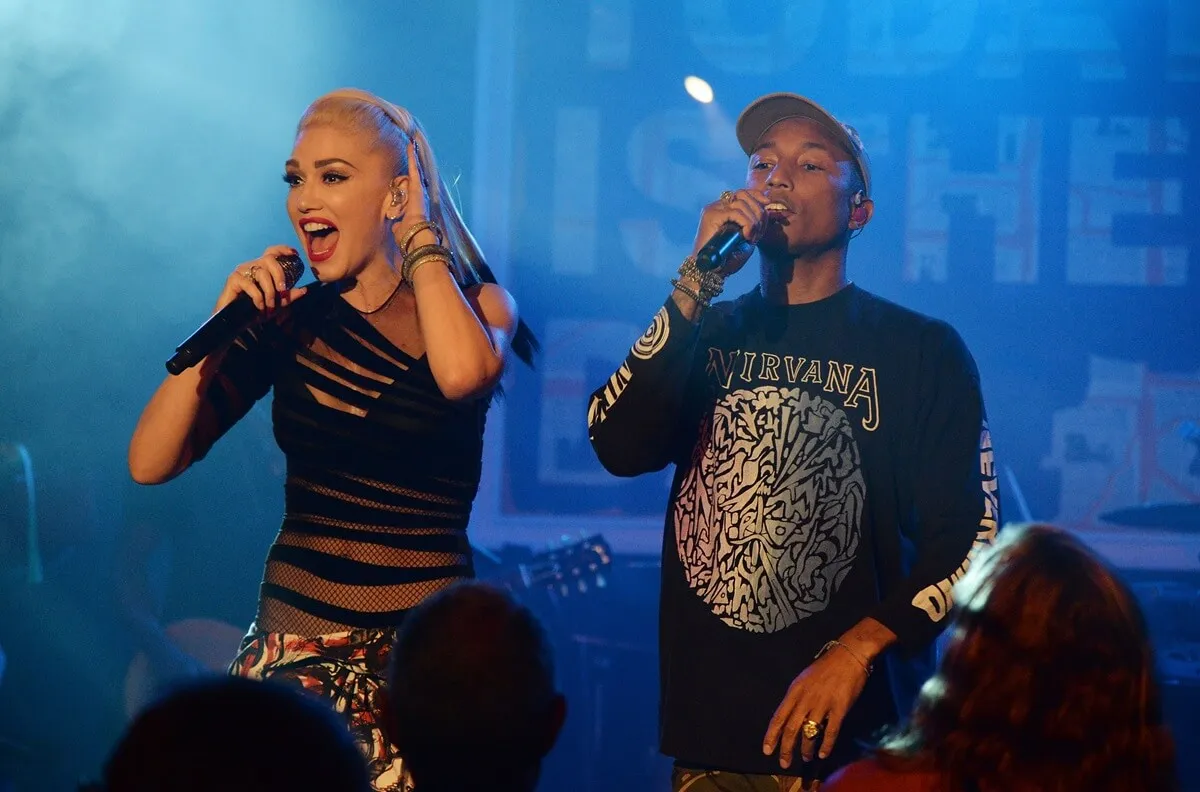 Gwen Stefani singing on stage alongside Pharrell.