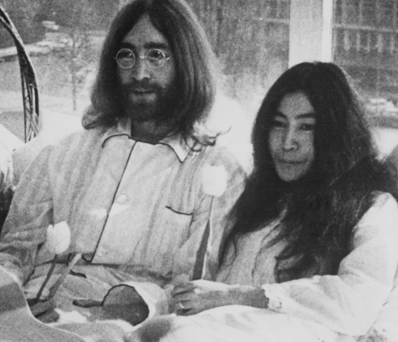 John Lennon and Yoko Ono in bed