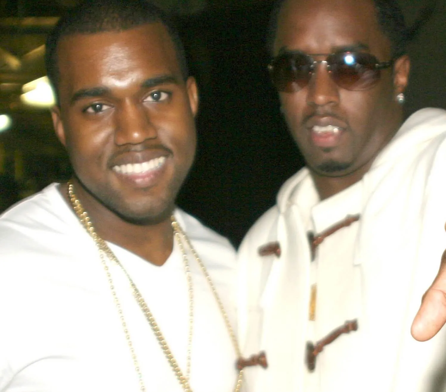 Kanye West and Sean "Diddy" Combs wearing white