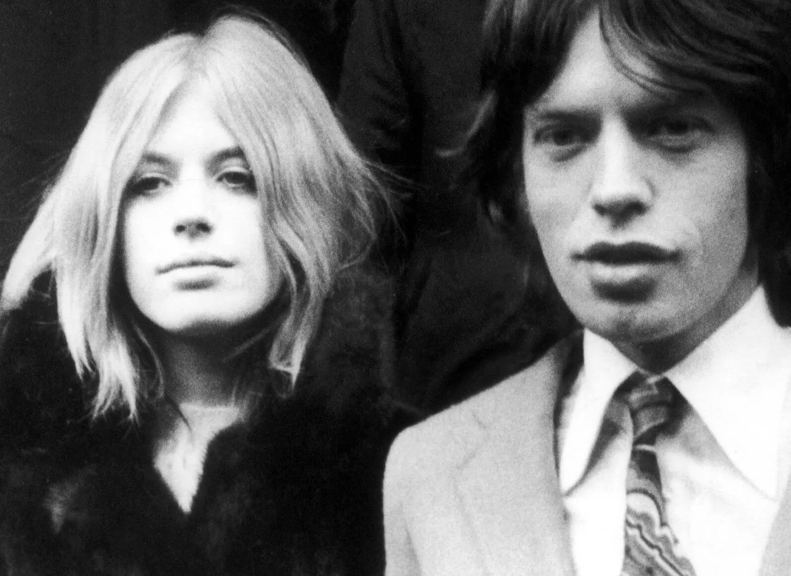 Marianne Faithfull standing next to The Rolling Stones' Mick Jagger