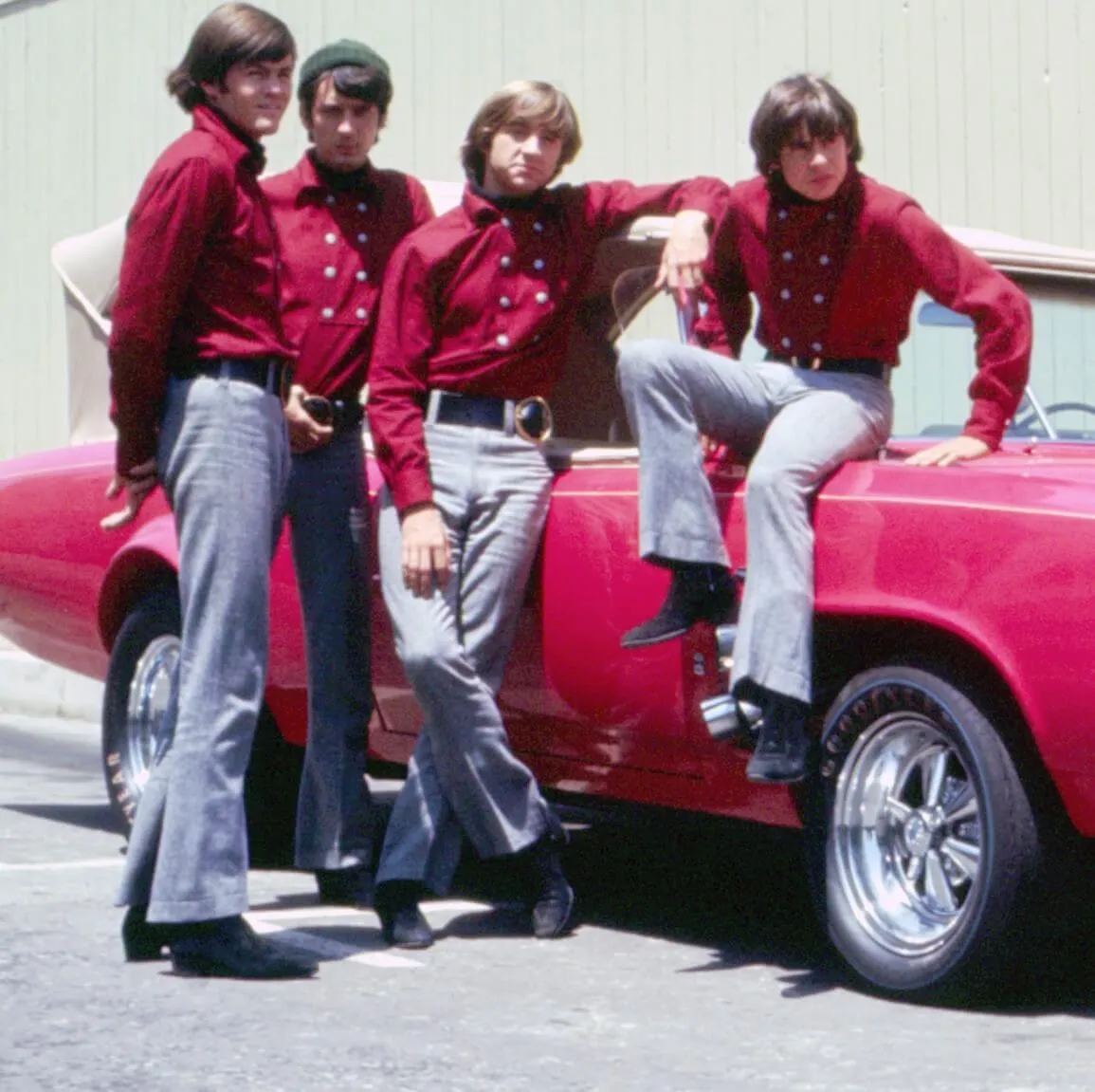 The Monkees with the Monkeemobile from their TV show