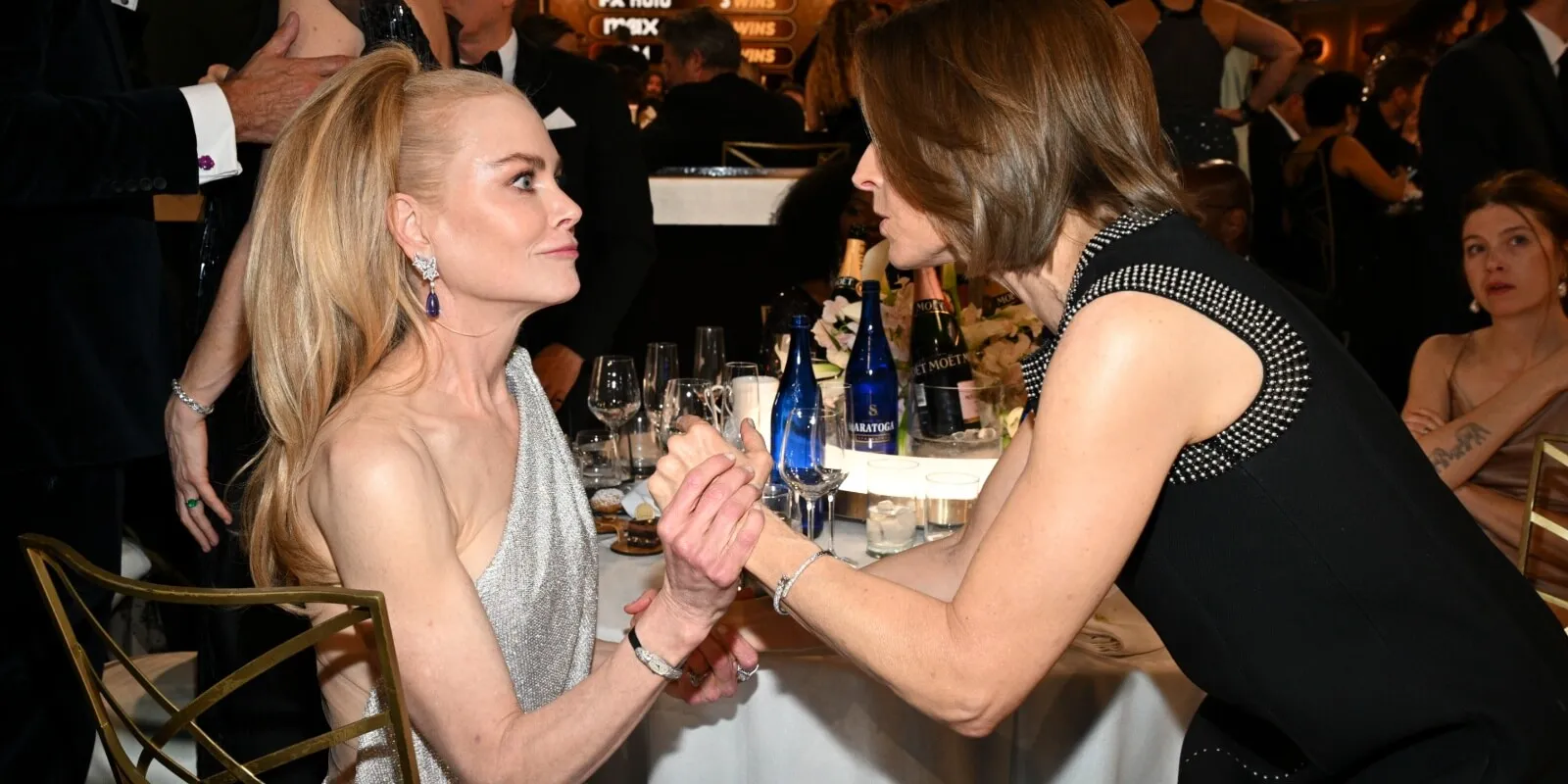 Nicole Kidman talks to Jodie Foster at the 2025 Golden Globe Awards.