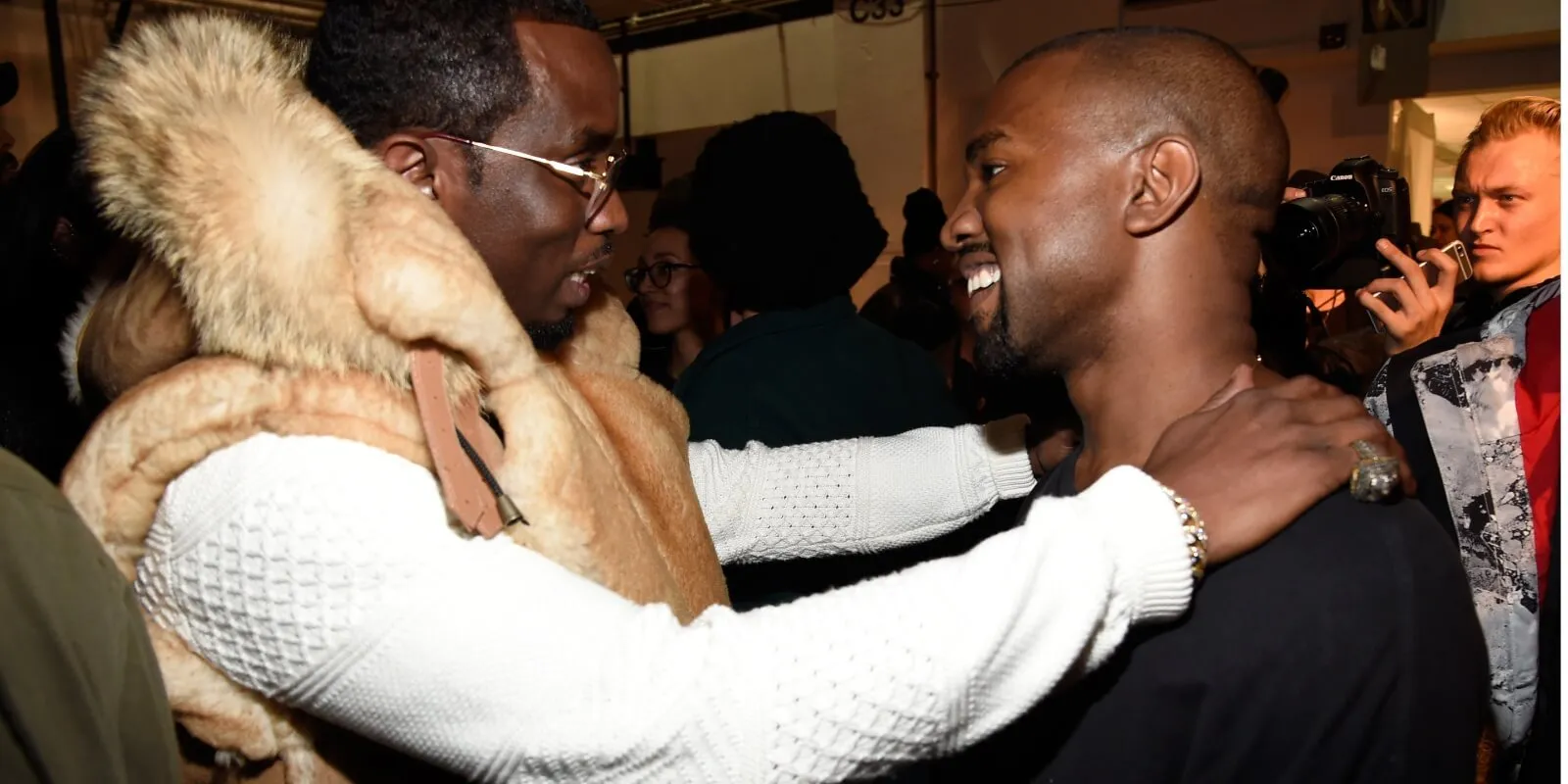 Sean 'Diddy' Combs embraces Kanye West in 2015