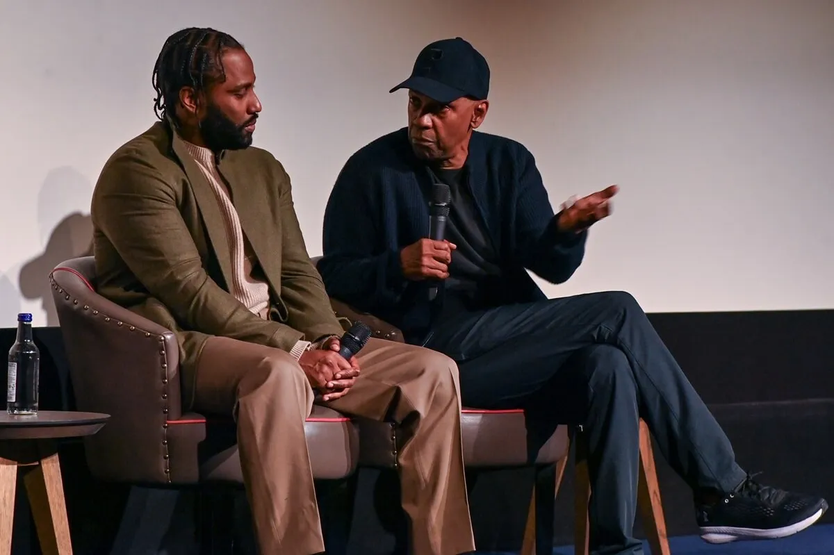 John David Washington talking to his father Denzel Washington at the Netflix Special Screening of "The Piano Lesson".